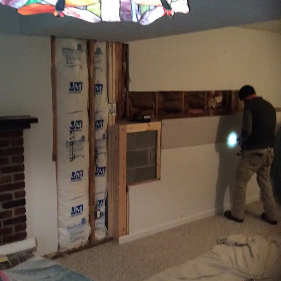 Restoration technician inspecting water damage in Cresskill
